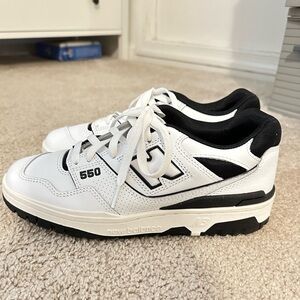 White with black New Balance 550s